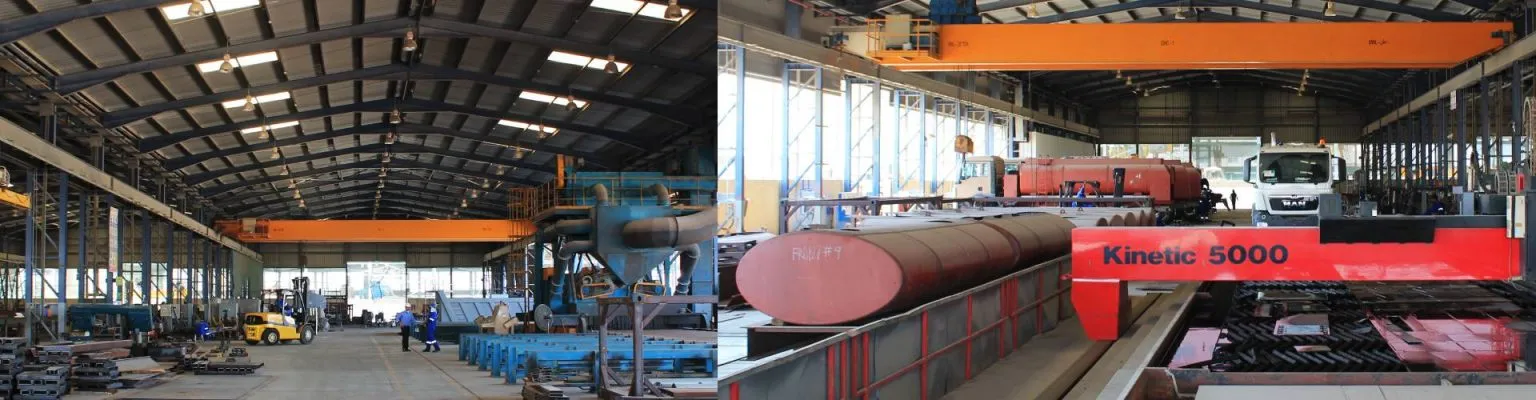 Interior view of Diamond Steel Industries' fabrication facility in the UAE showing heavy machinery, overhead cranes, and manufacturing operations